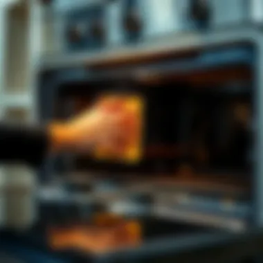 A person using a sponge to clean an oven surface