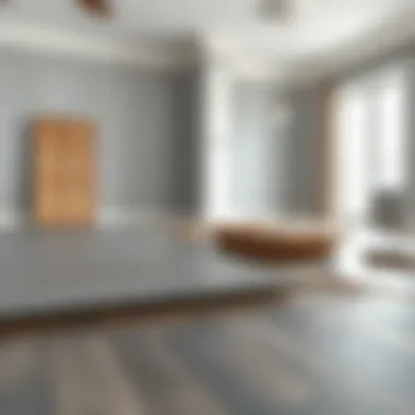 Installation of gray parquet flooring in progress